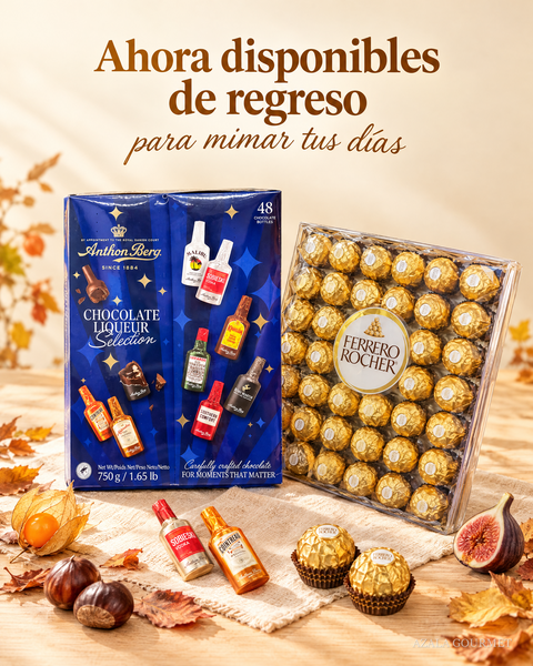 Cajas de Anthon Berg y Ferrero Rocher sobre madera clara con hojas de otono. Ahora disponibles de regreso para mimar tus dias.